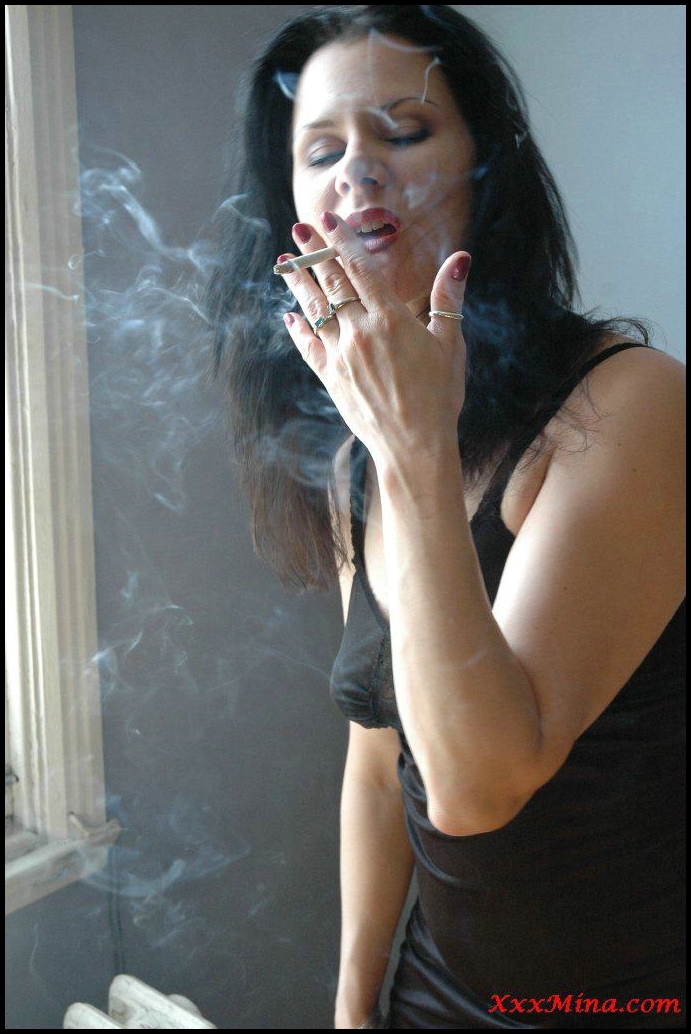 XXX Mina smoking seductively